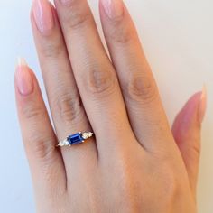 The high contrast combination of vivid blue sapphires and twinkling white diamonds has stood the test of time and Anna Sheffield makes it her own with this compact ring that's easy to wear, yet loaded with personality. The east-west setting is a perfect way to turn a sizable sapphire into an everyday statement. Understated brides and gemstone lovers will both find something to love about this ring. Designed in New York. 14 karat gold set with an approximately 0.75 carat (6 mm x 4 mm) emerald-cut Anna Sheffield, Yellow Gold Setting, Blue Sapphire Rings, High Contrast, East West, Gold Set, White Diamonds, Sheffield, Eternity Bands