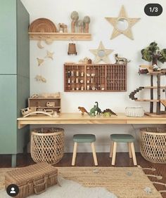 a room filled with lots of wooden furniture and decorations on the wall next to a green cabinet