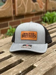 These leather patch Richardson 112 hats are a great way to flaunt your style and look sleek at the same time. Patches made from 100% leather and engraved with a crisp design and hand stitched on our most popular style of hat. Your friends are going to be jealous! To submit custom logo- Please email brent@lumberjackdesignco.com with the Vector logo, it will be labeled .eps, .ai, .pdf (Please do not submit a jpg in this format as this will need redrawn and art charges will apply for hourly rates!) Rugged Leather Hat With Patch, Rugged Leather Hat With Leather Patch, Trucker Style Six-panel Baseball Cap With Leather Patch, Classic Brown Trucker Hat With Flat Brim, Classic Flat Bill Hat With Logo Patch, Adjustable Leather Baseball Cap With Leather Patch, Leather Hat With Curved Brim And Leather Patch, Trucker Hat With Leather Patch, Six-panel, Trucker Hat With Leather Patch And Short Brim