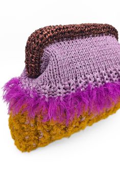 a purple and yellow knitted object with fuzzy edges