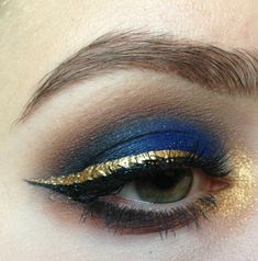 Gold And Navy Blue Makeup Looks, Blue And Gold Cheer Makeup, Navy Gold Eye Makeup, Navy And Gold Eyeshadow, Dark Blue And Gold Eye Makeup, Gold Blue Eye Makeup, Navy And Gold Eye Makeup, Blue And Gold Makeup Ideas, Gold Blue Eyeshadow