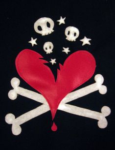 a red heart with bones and stars is on a black background, surrounded by skulls