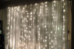 the curtain is covered with white lights