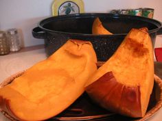 a couple of pieces of food sitting on top of a plate next to a pot