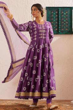 Purple Anarkali featuring long sleeves, round neckline, and floral block print detailing. Paired with a churidar and organza dupatta adorned with gold lace., Fit: Relaxed Long Sleeves Anarkali, Block Print Anarkali, Purple Anarkali, Floral Block Print, Organza Dupatta, Women Kurta, Gold Lace, Churidar, Purple Floral