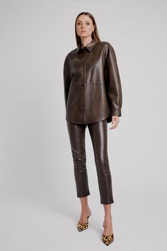 Elements of ease. The Jaedon Vegan Leather Shirt strikes function and fashion in a minimalist vegan leather design with a cool oversized fit, dropped shoulder, tortoiseshell button-down front and a standard collar. SIZING: Oversized fit. AU: Model wears a size 8 / US: wears a size 4.FABRICATION: Main base: 55% polyester, 45% cotton - Button-down front - Drop shoulder - Standard collar Modern Brown Tops For Workwear, Modern Brown Top For Work, Brown Leather Casual Tops, Brown Leather Long Sleeve Top, Casual Brown Leather Top, Casual Brown Leather Tops, Modern Brown Tops For Fall, Brown Leather Top For Fall, Corsets Fashion