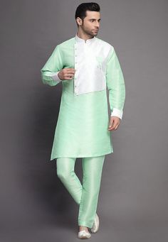 Art Silk Kurta in Sea GreenThis Readymade attire is Enhanced with Buttons. Crafted in Chinese Collar Neck and Full SleeveAvailable with an Art Silk Pant in Sea GreenDo note: Footwear shown in the image is for presentation purposes only. Half to one inch may vary in measurement. (Slight variation in actual color vs. image is possible) We sell all kinds of menswear. Mens Kurta | Mens Kurta Pajama | Mens Sherwani | Mens Sherwani Sets | Traditional Menswear | Partywear Menswear | Indian Mens Dresses Fitted Pista Green Sets For Ceremonial Occasions, Fitted Kurta With Set-in Sleeves For Wedding, Fitted Wedding Kurta With Set-in Sleeves, Traditional Designer Sets With Set-in Sleeves, Green Designer Wear Sets, Traditional White Sets With Set-in Sleeves, Designer Green Long Sleeve Sets, Indian Jackets, Mens Sherwani