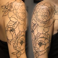 a woman's arm with flowers and leaves tattooed on the back of her arms