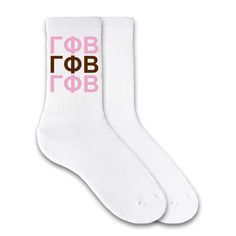 two pairs of white socks with pink and brown letters on the bottom, one is for women