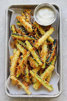 fried zucchini fries with ranch dressing on a tray