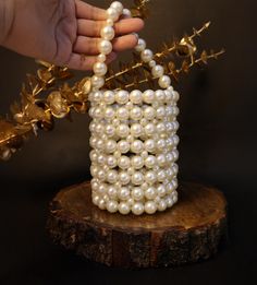 Elevate your bridal or party look with this stunning Round Pearl Beaded White Clutch Bag, designed to add a touch of elegance and sophistication to any outfit. This exquisite clutch is perfect for brides, bridesmaids, and anyone looking to make a statement at weddings, proms, or other special occasions. Handcrafted with shimmering pearls, this round clutch features a convenient handle, allowing you to carry it effortlessly. The luxurious pearl beading and secure clasp offer both style and practicality, making it an ideal accessory for any special day. Handmade Pearl Evening Bag For Wedding, White Bags With Pearl Handle For Reception, White Beaded Bag For Reception, Cream Beaded Bags For Reception, White Pearl Embellished Bags For Reception, White Bridal Accessories With Pearl Handle For Party, Handmade Pearl White Evening Bag For Wedding, Traditional White Evening Bag With Pearl Handle, White Pearl Embroidered Evening Bag For Reception