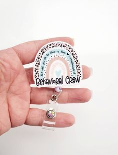 This Behavioral Crew badge reel is made with premium white acrylic and ink is pressed directly into it making it long lasting. It measures approx. 2 inches. It is attached to a retractable plastic Badge reel Available in Alligator Clip, Belt Clip, or Lanyard Cute White Craft Supplies For Personal Use, Customizable White Craft Supplies For Hobby, Adjustable White Badge Holder For Hobby, Customizable White Badge Holders For Personal Use, Customizable Adjustable White Badge Holders, Adjustable Customizable White Badge Holders, Rainbow Badge, Child Life Specialist, Clip Belt