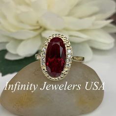 This ring is an elongated oval lab created ruby with halo diamond design, 14k yellow gold #6220 Instagram https://www.instagram.com/p/BxdTrhJgi8B/?utm_source=ig_share_sheet&igshid=rvwra47lnj4f We feature the finest quality lab grown rubies in the world. The properties of lab-grown are physically, chemically and visually identical to natural, just grown in a lab setting. -Approximate total carat weight: 5.10ctw diamond equivalent -Center Stone Size: approx. 5.00ct diamond equivalent -Center S Oval Lab-created Ruby Fine Jewelry For Wedding, Oval Lab-created Ruby Ring For Anniversary, Oval Lab-created Ruby Wedding Jewelry, Oval Ruby Halo Ring In Yellow Gold, Formal Oval Lab-created Ruby Jewelry For Weddings, Oval Lab-created Ruby Ring With Center Stone, Oval Ruby Ring In 14k Gold For Wedding, 14k Gold Oval Ruby Ring For Wedding, Oval Ruby Halo Ring For Formal Occasions