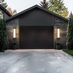 a garage with two lights on the side of it