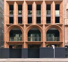 a large brick building with arches and windows