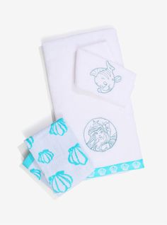 two towels and one towel with an image of a mermaid on it, both in blue