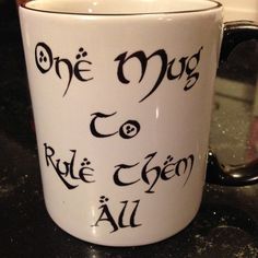 a white coffee mug with black writing on it