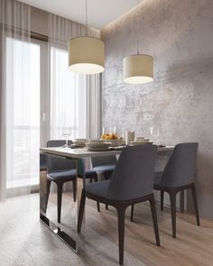 a dining room table with four chairs around it