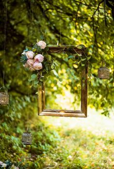 an old photo frame with flowers hanging from it in the woods royalty photos, images and clippings