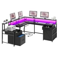 a computer desk with three computers on it and purple lighting under the desk is an office chair