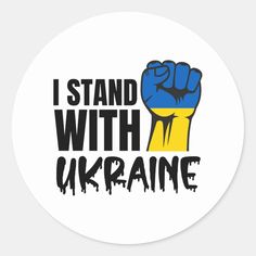 i stand with ukraine sticker in black and yellow on a white round background that says i stand with ukraine