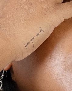 a woman's arm with writing on it