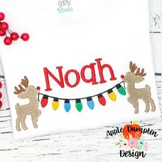 a white t - shirt with reindeers and lights on it that says noch