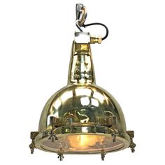 an antique brass hanging light fixture against a white background