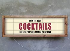 a wooden sign that says only the best cocktails created for your special enjoyment on concrete