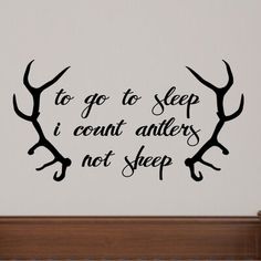 a wall decal that says to go to sleep i count antlers not sleep