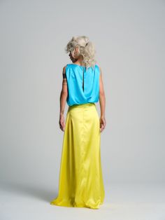 Endless optimism is easy to attain when you are wearing our flowy yellow skirt. Complete with a functional set of pockets, this piece offers the best of both worlds - timeless elegance and comfort. FEATURES:High-waisted maxi skirt with functional pockets and a back zipper. Please note that this piece is not lined and the waist is not elastic.100% Handmade. SIZE & FIT:Fit: A relaxed fit with room to moveModel is wearing size Small or S/MView our SIZE CHART before ordering MATERIALS & CARE:Content: 100% PolyesterCare: Machine wash on cold (30ºC) with a mild detergent. SHIPPING:Made to order, processing time is 15 working daysThis item will be shipped via DHL Spring Evening Maxi Dress With Relaxed Skirt, Spring Evening Maxi Dress With Relaxed Fit, Flowy Maxi Evening Skirt, Flowy Maxi Skirt For Evening, Yellow Long Skirt For Evening, Yellow Flowy Dress With Lined Skirt, Fitted Yellow Maxi Skirt, Yellow Flared Dress With Lined Skirt, Elegant Long Yellow Skirt