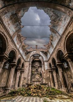 the inside of an old church with stone arches