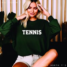 Elevate your casual wardrobe with our Unisex Tennis Sweatshirt, a perfect blend of comfort and style. Crafted from premium, soft cotton, this sweatshirt features the word "TENNIS" boldly  across the front, making it a must-have for tennis enthusiasts. Whether you're heading to the court or lounging at home, this versatile piece offers a relaxed fit that suits any occasion. Available in a variety of sizes, classic colors and option to change sport, our Tennis Sweatshirt is designed to keep you co Tennis T Shirt, Tennis Sweatshirt, Tennis Sweater, Hockey Sweatshirts, Lovers Embrace, Sports Sweatshirt, Tennis Tshirts, Tennis Gifts, Tennis Match