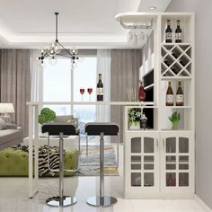 a living room filled with furniture and a wine rack in the middle of the room