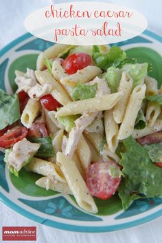 a green plate topped with pasta salad and chicken