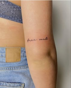 a woman's arm with the words peace and love tattooed on her left arm