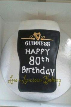 a guinness happy 80th birthday cake in a box