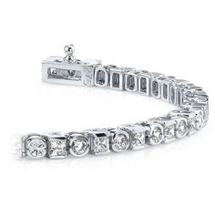 Twenty seven round cut diamonds and twenty seven princess cut diamonds are half bezel set in this diamond tennis bracelet in 14k white gold. Approximately 4 carat total diamond weight and proudly made in the USA. White Platinum Tennis Bracelet With 17 Jewels, Exquisite Platinum Tennis Bracelet With Diamond Accents, Platinum Tennis Bracelet With Diamond Accents, White Gold Baguette Cut Bracelet With Diamond Accents, Formal Platinum Tennis Bracelet With Diamond Accents, Formal White Gold Tennis Bracelet With Diamond Accents, White Gold Bracelets With Diamond Accents Baguette Cut, White Gold Diamond Bracelet With Vvs Clarity For Anniversary, White Gold Platinum Tennis Bracelet With Diamond Cut