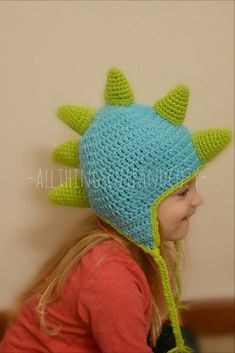 RAWR!  All dinosaur lovers will go crazy for this hat ! Made with  soft yarn, it not only looks cute but will keep your head warm all winter long!  This is perfect for birthday presents, Christmas presents, baby showers and even Halloween costumes ! You can choose any two colors to make this completely your own, Just let me know at check out. This hat is available in *Newborn (up to 2 weeks old, its about 13.5inches) *0-3 Months (14.5inches) *3-6 Months 15.5 inches *6-9 Months 16.5 inches *9-12 Crochet Dinosaur Hat, Dragon Hats, Dinosaur Hat, Earflap Beanie, Crochet Dinosaur, Baby Dino, Dino Birthday, Animal Hats, Birthday Hat