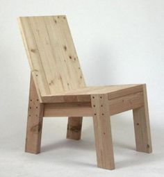 a wooden chair sitting on top of a white floor