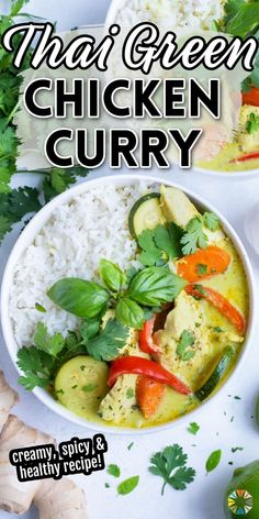 two bowls filled with chicken curry next to white rice and green garnishes