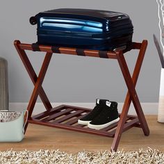 a pair of shoes is sitting on a wooden rack with a blue cooler behind it