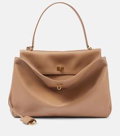 Rodeo Large leather tote bag in beige - Balenciaga | Mytheresa Beige Office Bag With Turn-lock Closure, Chic Beige Satchel With Turn-lock Closure, Luxury Beige Shoulder Bag With Turn-lock Closure, High-end Satchel With Turn-lock Closure, High-end Top Handle Bag With Turn-lock Closure, High-end Bags With Turn-lock Closure For Everyday Use, Elegant Tote Shoulder Bag With Turn-lock Closure, Beige Double Handle Bag With Turn-lock Closure, Chic Beige Bag With Turn-lock Closure