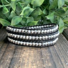 "This triple wrap beaded bracelet will look great with your favorite pair of jeans or your little black dress. Made with black leather cord, 4mm faceted silver Czech glass beads. It will fit a 6 1/2\"- 7 1/2\" wrist. You can send me your wrist measurement for a custom order at no extra charge." Adjustable Black Beads Wrap Bracelet, Adjustable Black Wrap Bracelet With Black Beads, Handmade Bohemian Black Wrap Bracelet, Silver Multi-strand Beaded Wrap Bracelet, Bohemian Leather Wrap Bracelet, Adjustable, Silver Beaded Bracelet, Boho Wrap Bracelet, Everyday Bracelet, Black Bracelet