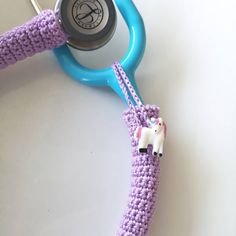 a crocheted toy horse attached to a stethoscope