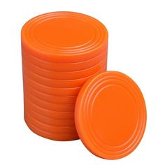 stack of orange frisbees sitting next to each other on a white background