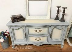 an old dresser painted blue with white paint