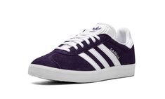 The adidas Gazelle “Rich Purple” is a colorway of the retro low-top sneaker with a purple-based appearance.  The popular and timeless adidas Gazelle in the “Rich Purple” colorway features a deep purple suede construction with white leather Three Stripes branding on the sides.  A white printed “Gazelle” logo is seen on the lateral side.  Purple adidas TreFoil branding is located on the heel and on the tongue.  An all-white rubber sole unit completes the look.  Release date: April 2, 2021 Purple Samba Adidas, Adidas Gazelle Purple, Purple Adidas Sneakers, Purple High-top Adidas Sneakers, Adidas Purple Leather Sneakers, Adidas Trefoil, Purple Suede, Purple Shoes, Adidas Gazelle Sneaker