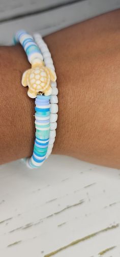 a close up of a person wearing a bracelet