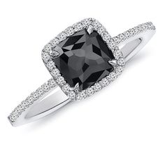 a black and white diamond ring on a white background